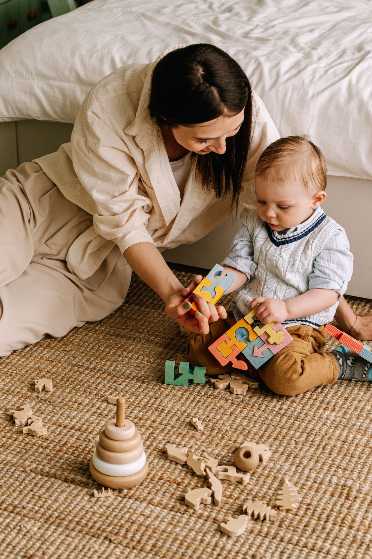 A parent playing with her child, the kind of everyday moment Puzzle to Paddock was founded to protect